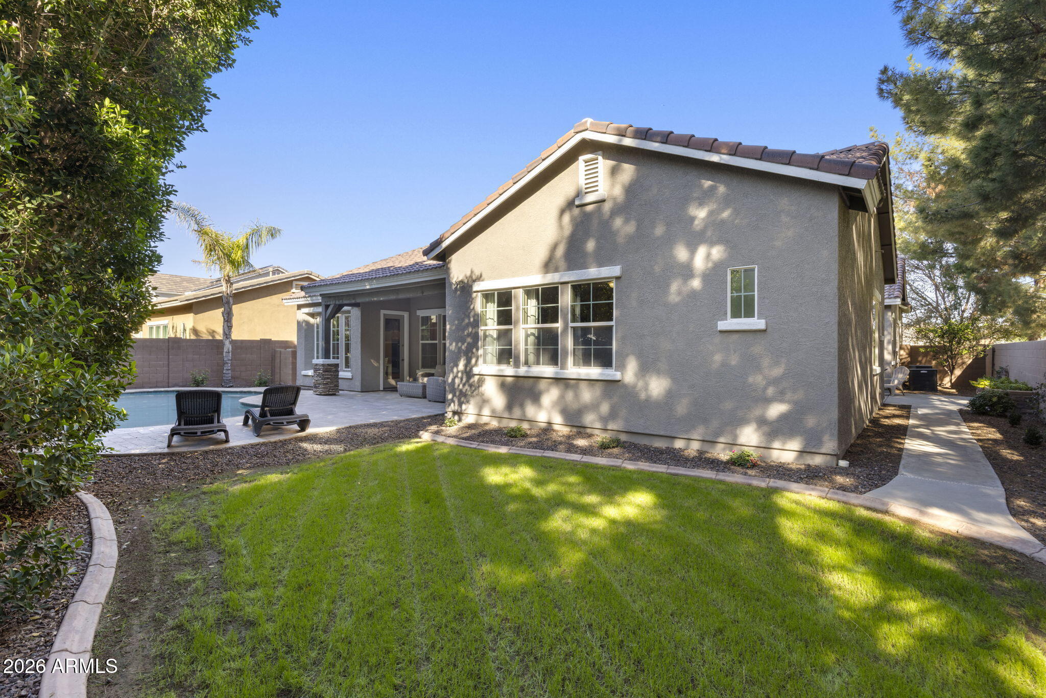 3831 East Weather Vane Road Gilbert, AZ 85296 - Photo 54 of 64 a view of a house with a yard patio and swimming pool