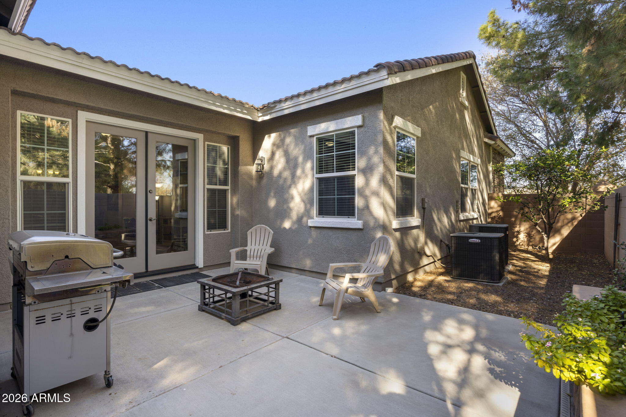 3831 East Weather Vane Road Gilbert, AZ 85296 - Photo 55 of 64 a view of a patio with table and chairs and potted plants