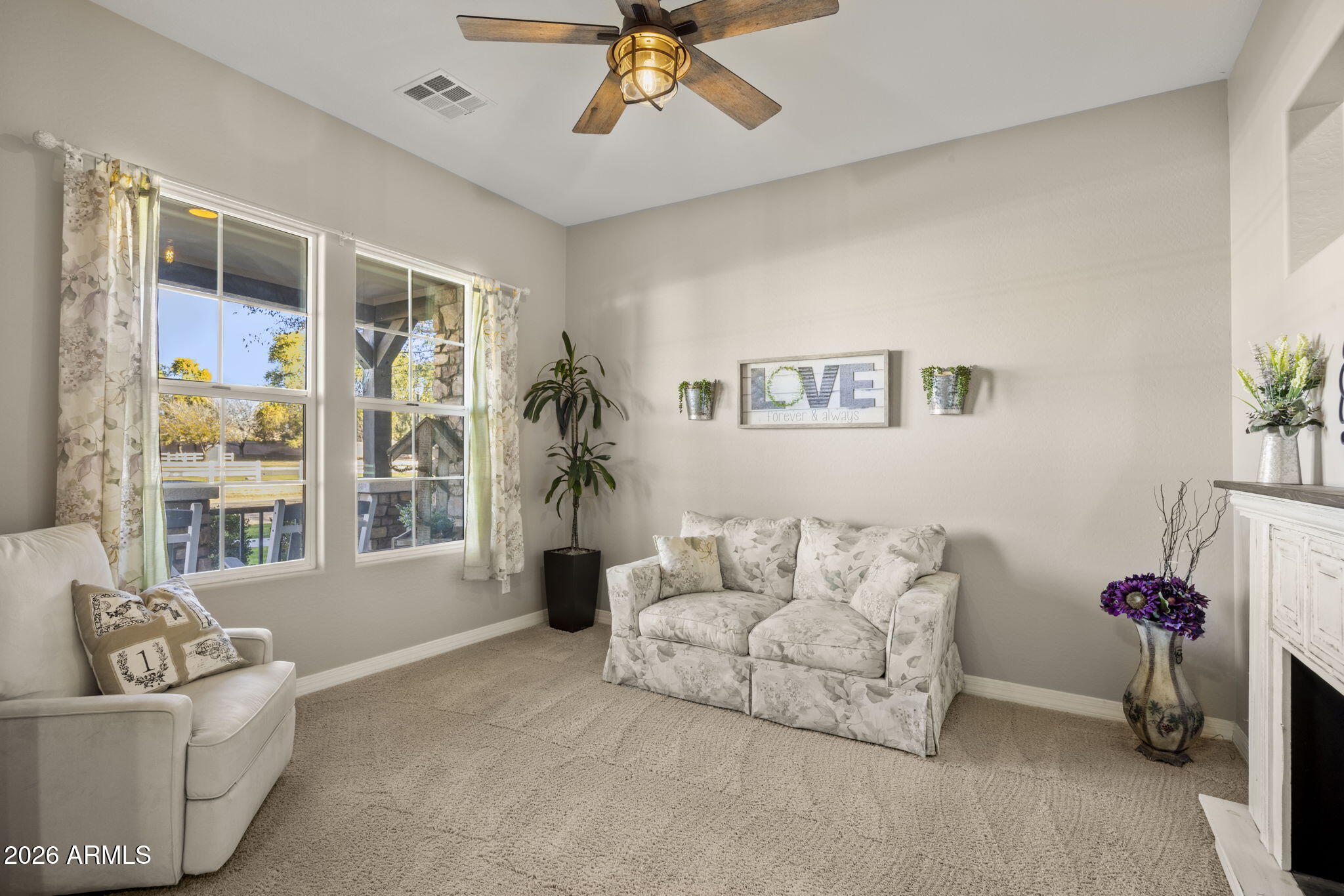 3831 East Weather Vane Road Gilbert, AZ 85296 - Photo 9 of 64 a living room with furniture and a large window