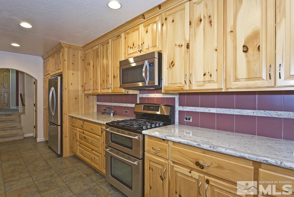 130 Sawmill Road Markleeville, CA 96120 - Photo 7 of 32 a kitchen with stainless steel appliances a stove a sink and a microwave