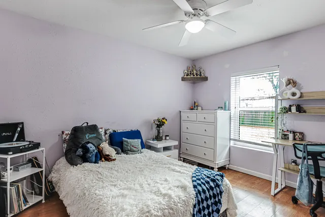 a bed room with a bed and a window