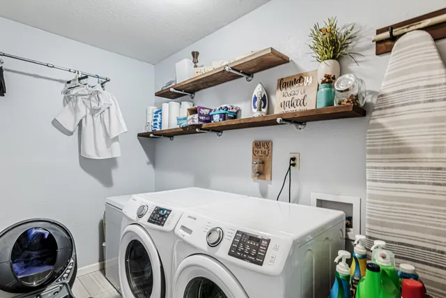 a utility room with dryer and washer
