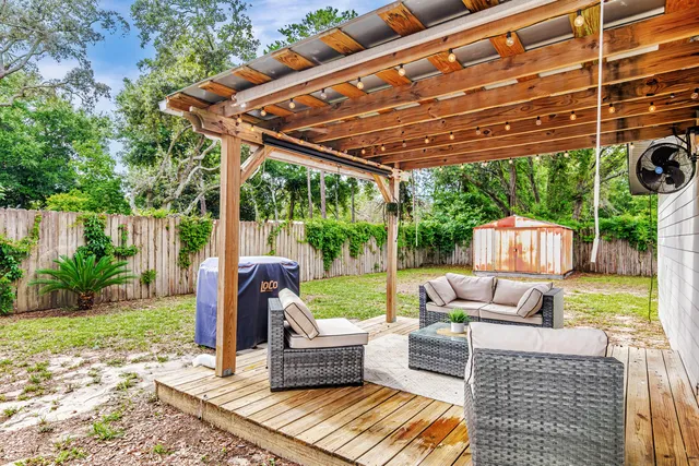 a view of a patio with couches chairs and a table