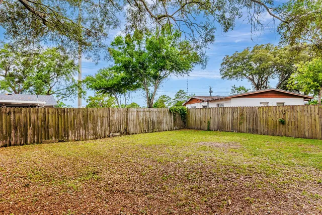 a view of a back yard with a small yard