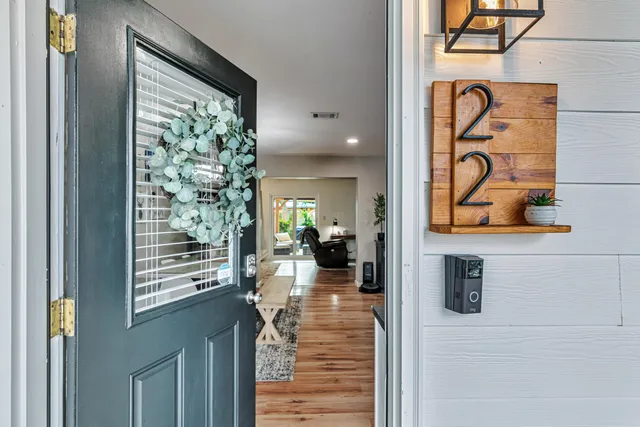 a view of a hallway with a potted plant
