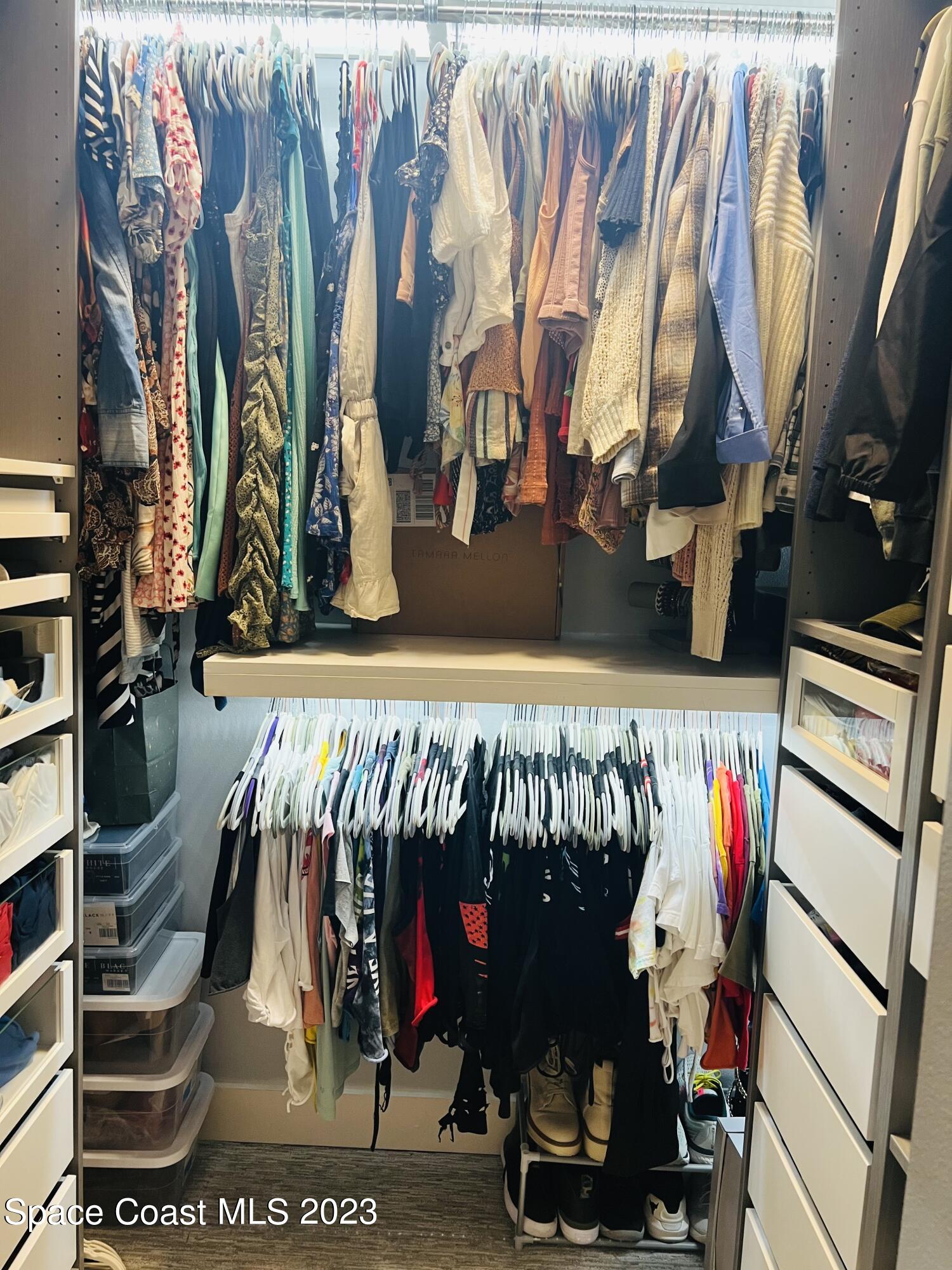3231 Windsor Estates Drive Melbourne, FL 32940 - Photo 15 of 40 a view of walk in closet with clothes