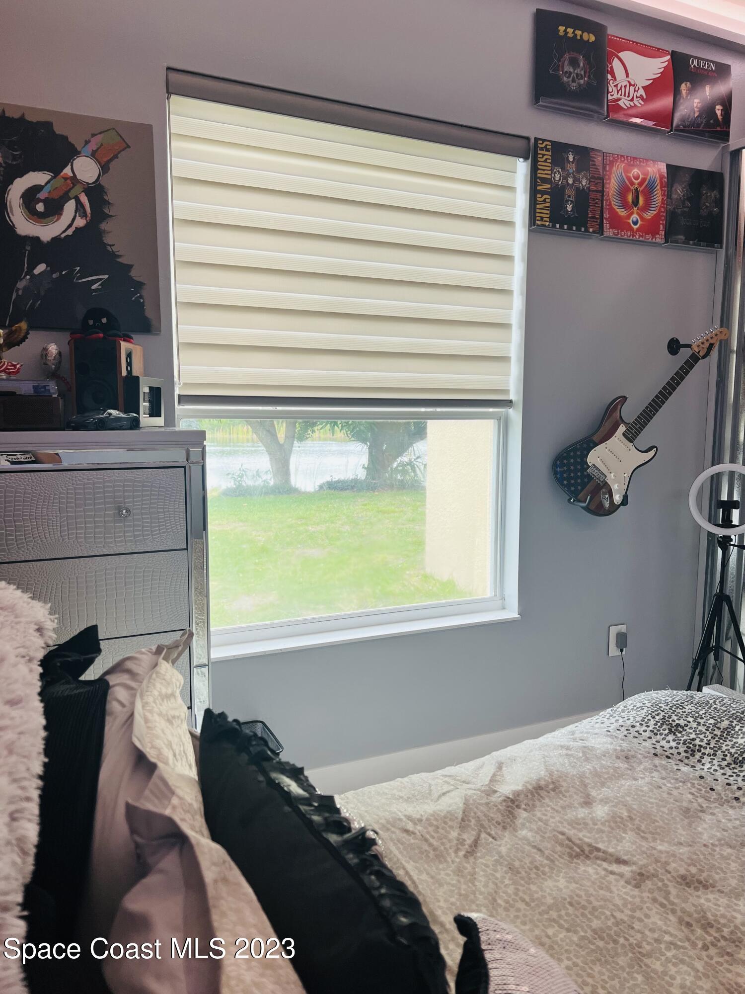 3231 Windsor Estates Drive Melbourne, FL 32940 - Photo 27 of 40 a bedroom with a bed and a window