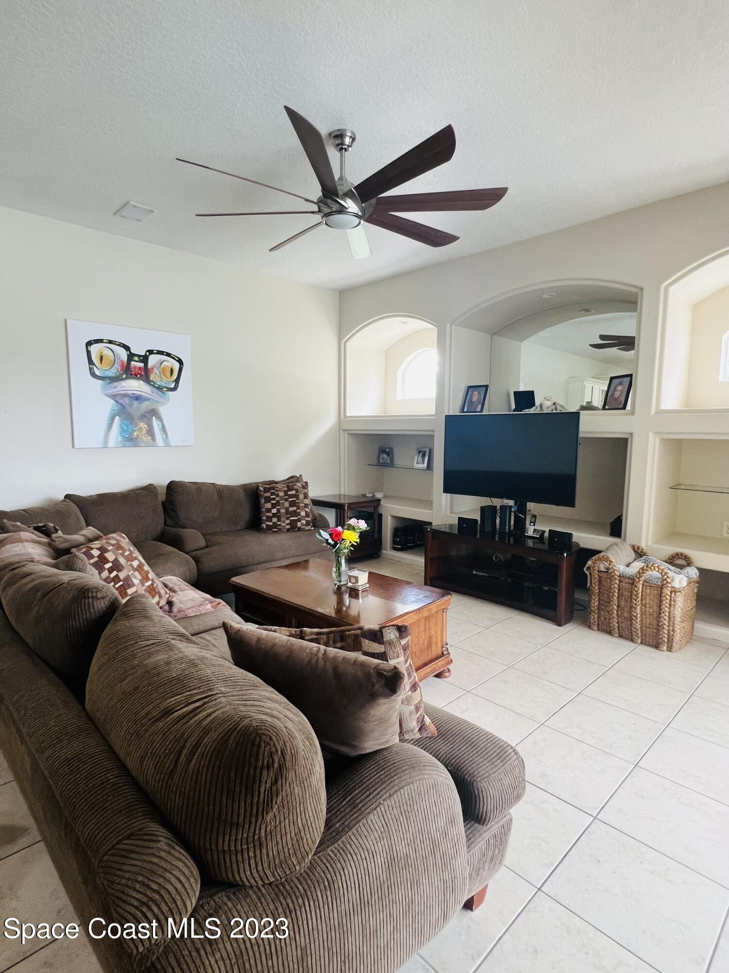 3231 Windsor Estates Drive Melbourne, FL 32940 - Photo 33 of 40 a living room with furniture