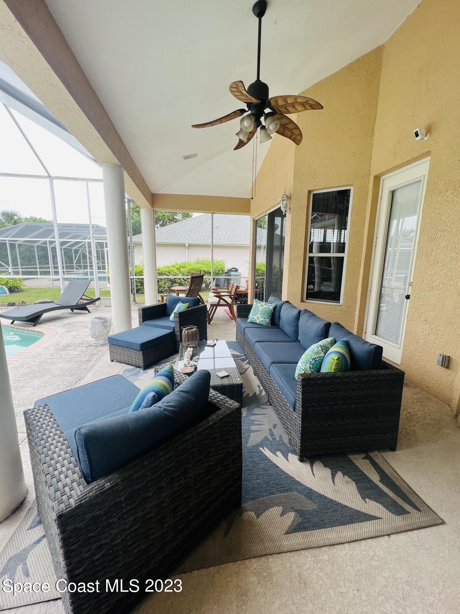 3231 Windsor Estates Drive Melbourne, FL 32940 - Photo 34 of 40 a living room with furniture and a large window