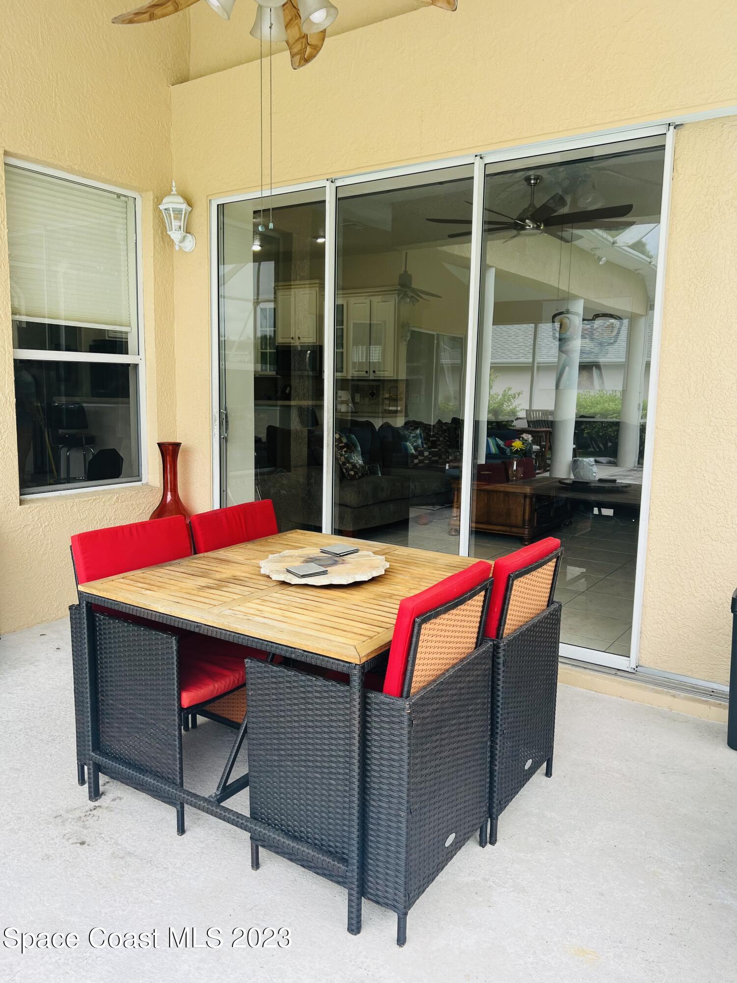 3231 Windsor Estates Drive Melbourne, FL 32940 - Photo 35 of 40 a room that has a bed and a table