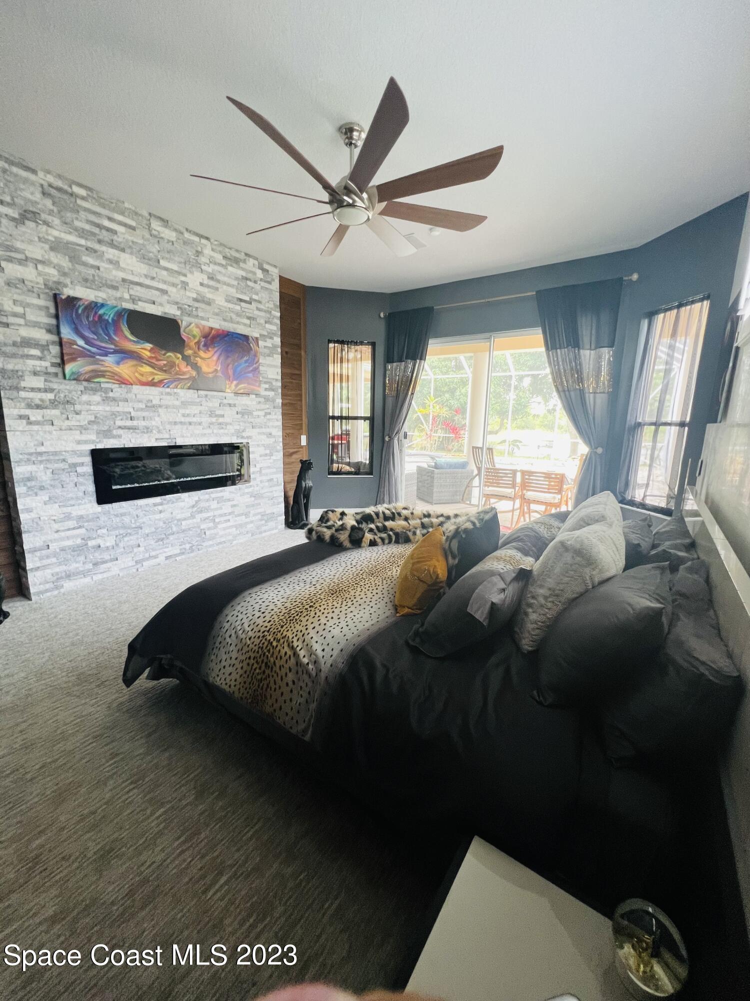 3231 Windsor Estates Drive Melbourne, FL 32940 - Photo 10 of 40 a bedroom with a bed and window