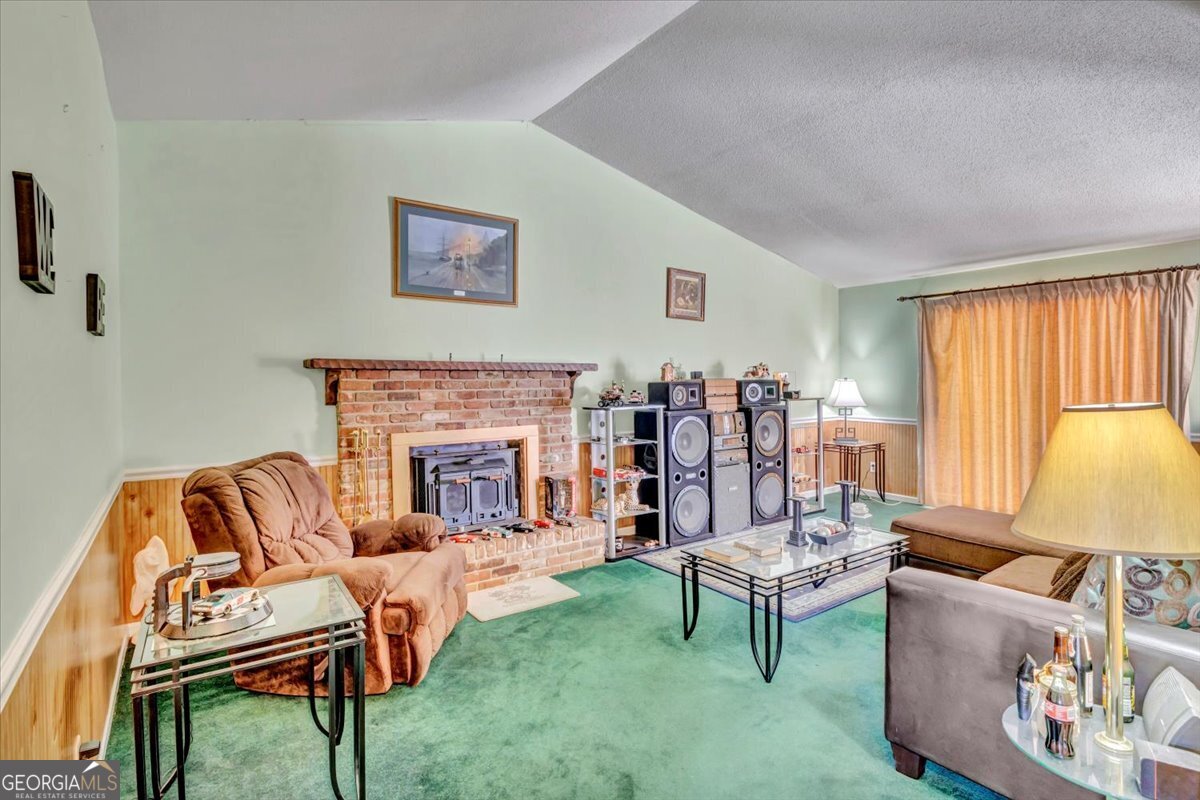 1702 Vada Road Bainbridge, GA 39817 - Photo 16 of 33 a living room with furniture and a fireplace