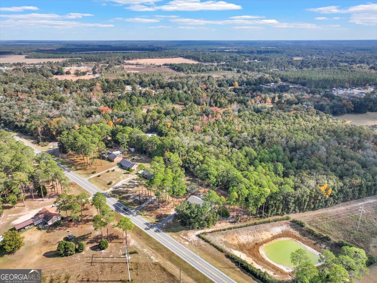 1702 Vada Road Bainbridge, GA 39817 - Photo 27 of 33 a view of a swimming pool with a yard and mountain view in back