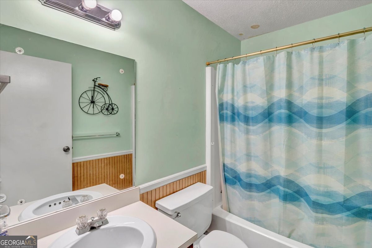 1702 Vada Road Bainbridge, GA 39817 - Photo 10 of 33 a bathroom with a sink and a mirror