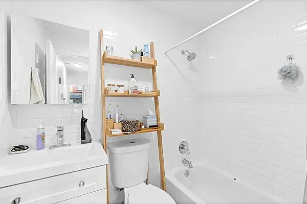 a bathroom with a sink a toilet and a bathtub