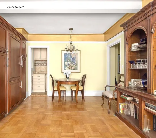 a view of a dining room with furniture and chandelier