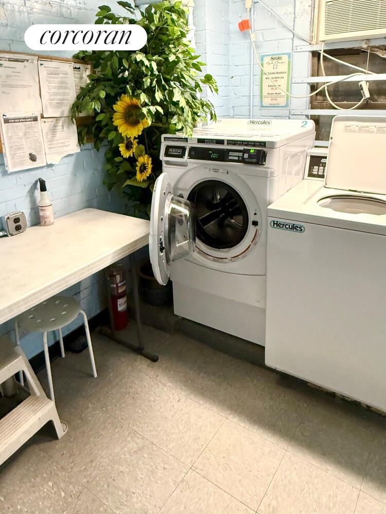 225 East 79th Street, Unit 2D Manhattan, NY 10075 - Photo 7 of 11 a utility room with dryer and washer