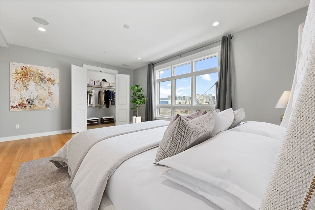 350 West 2nd Street, Unit 9 Boston, MA 02127 - Photo 16 of 42 a bedroom with a large bed and a large window