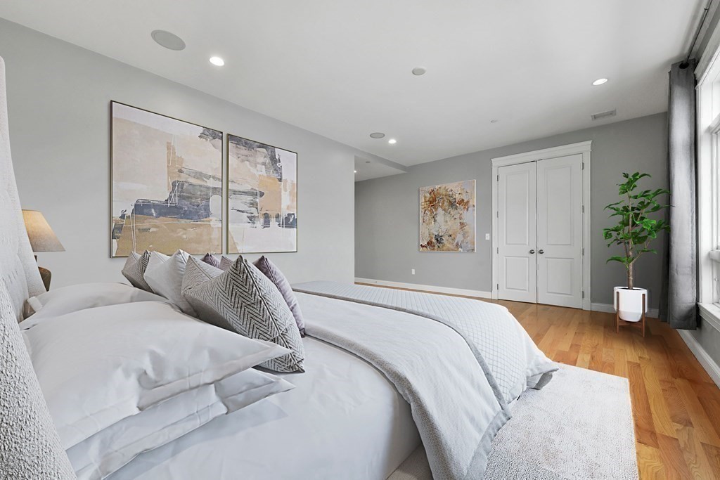 350 West 2nd Street, Unit 9 Boston, MA 02127 - Photo 17 of 42 a bed room with a large bed and a potted plant