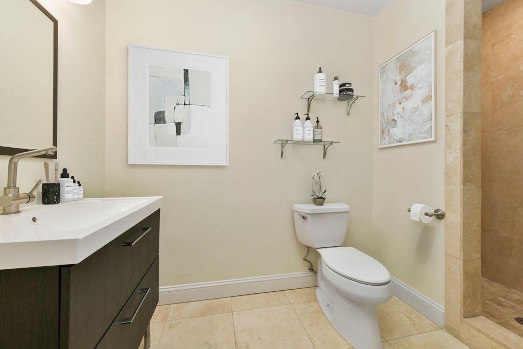 350 West 2nd Street, Unit 9 Boston, MA 02127 - Photo 23 of 42 a bathroom with a sink mirror and toilet