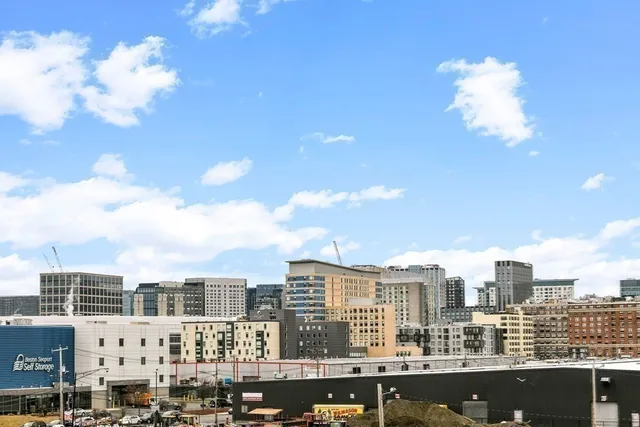 a view of a city with tall buildings