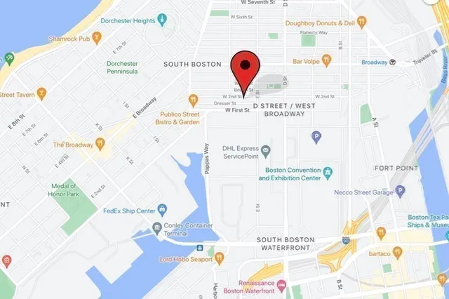 a picture of a bench in front of a building