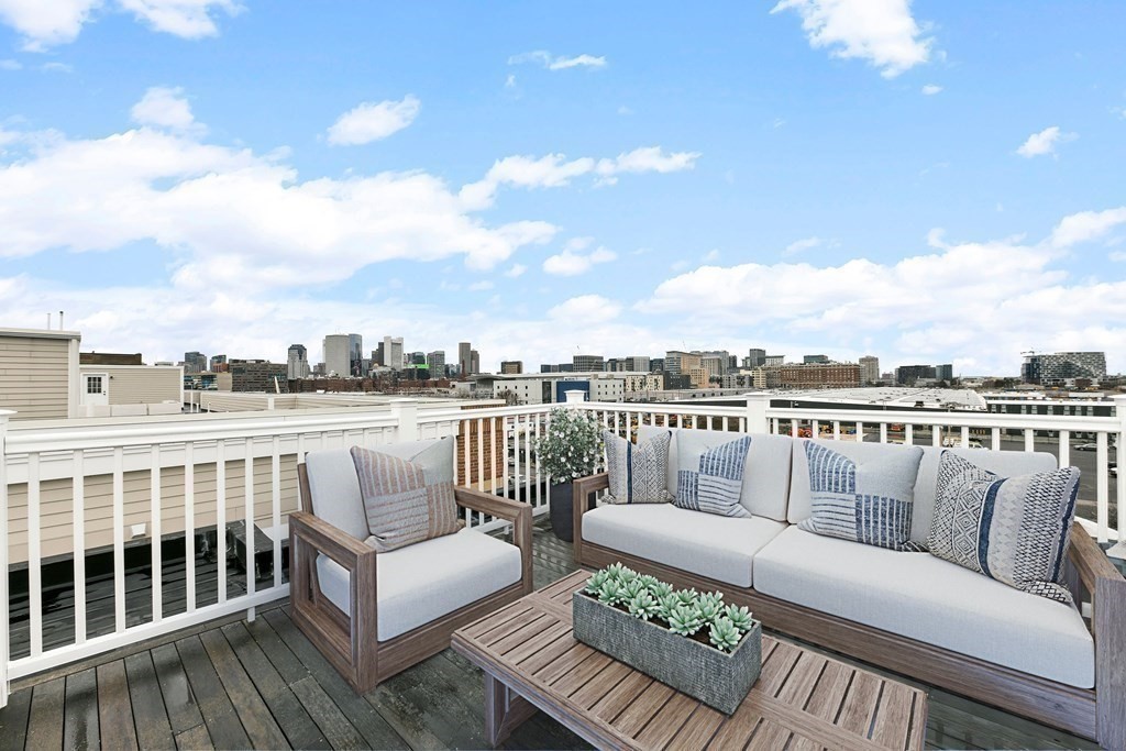 350 West 2nd Street, Unit 9 Boston, MA 02127 - Photo 5 of 42 a balcony with furniture and city view