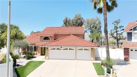 a house with trees in front of it