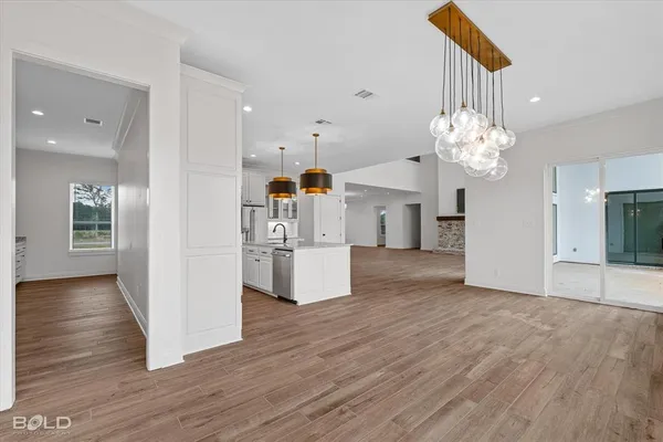 a view of kitchen with cabinets and wooden floor