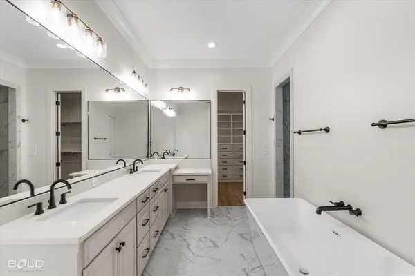 a bathroom with a double vanity sink mirror double and shower