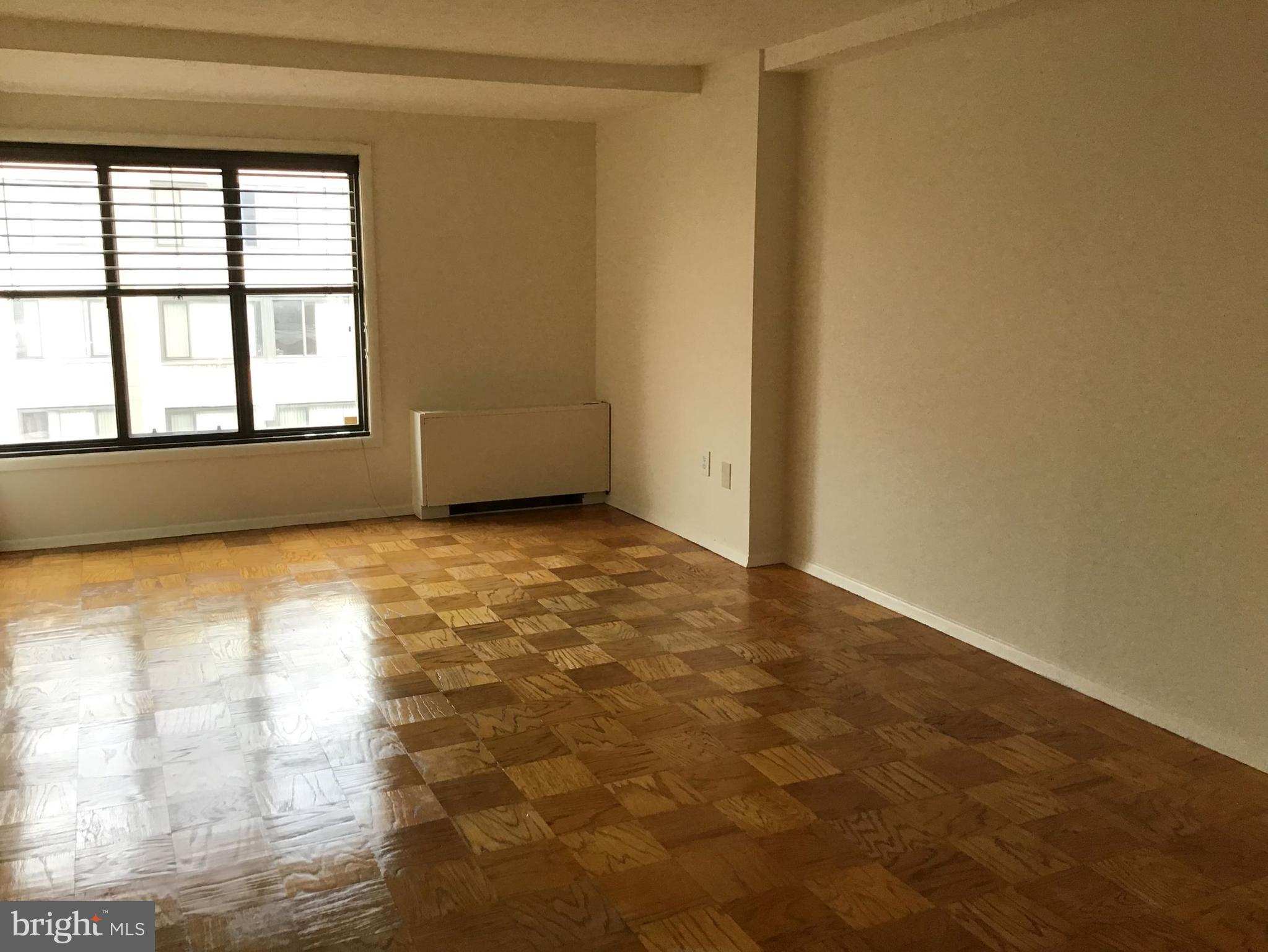 1440 N Street Northwest, Unit 812 Washington, DC 20005 - Photo 2 of 23 a view of an empty room and window