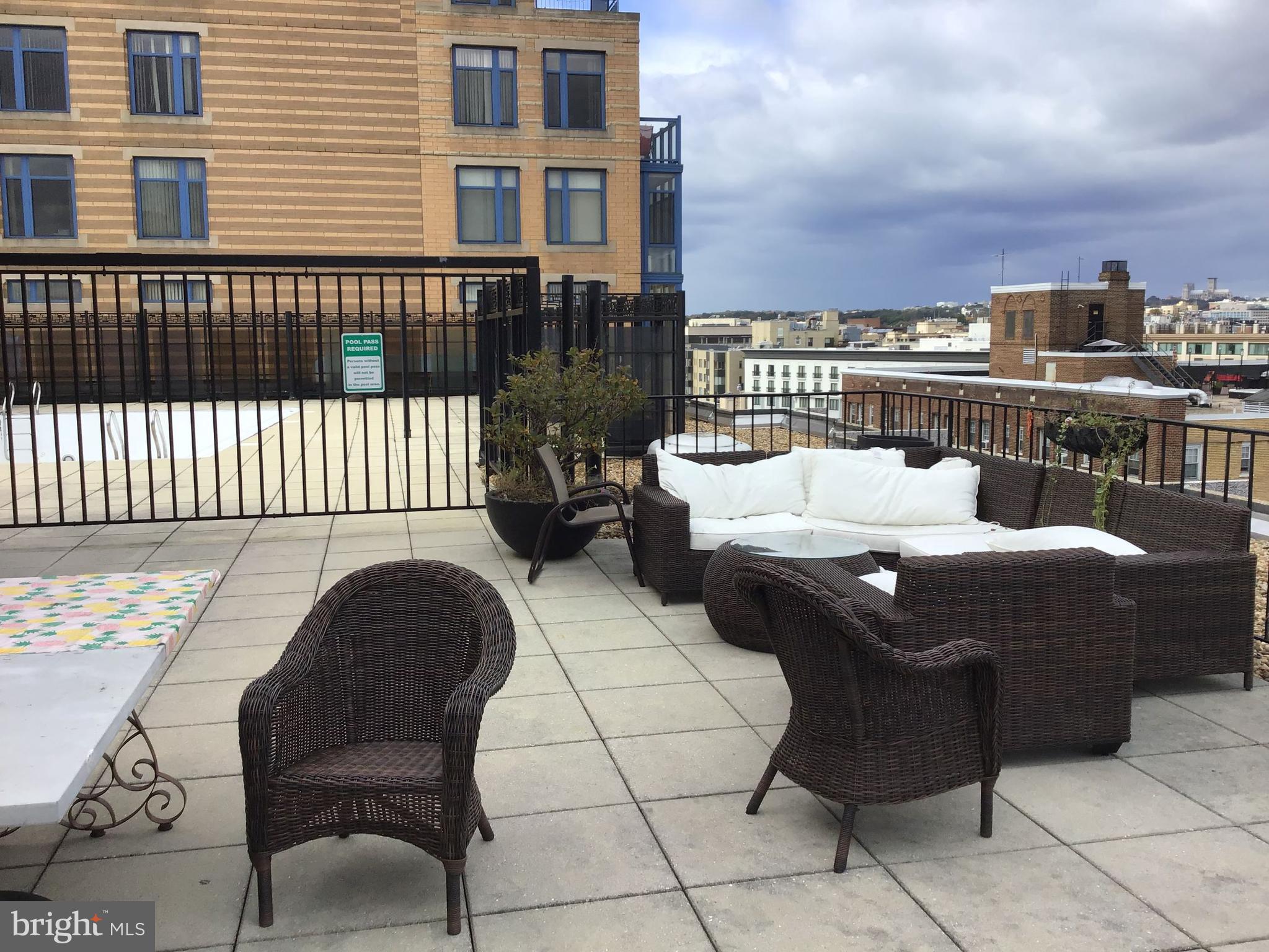 1440 N Street Northwest, Unit 812 Washington, DC 20005 - Photo 13 of 23 a terrace of a house with outdoor seating
