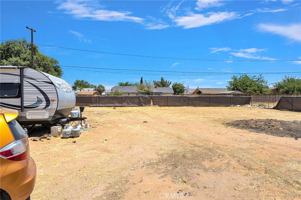 15471 Washoan Road Apple Valley, CA 92307 - Photo 31 of 38 a view of a yard with an outdoor space