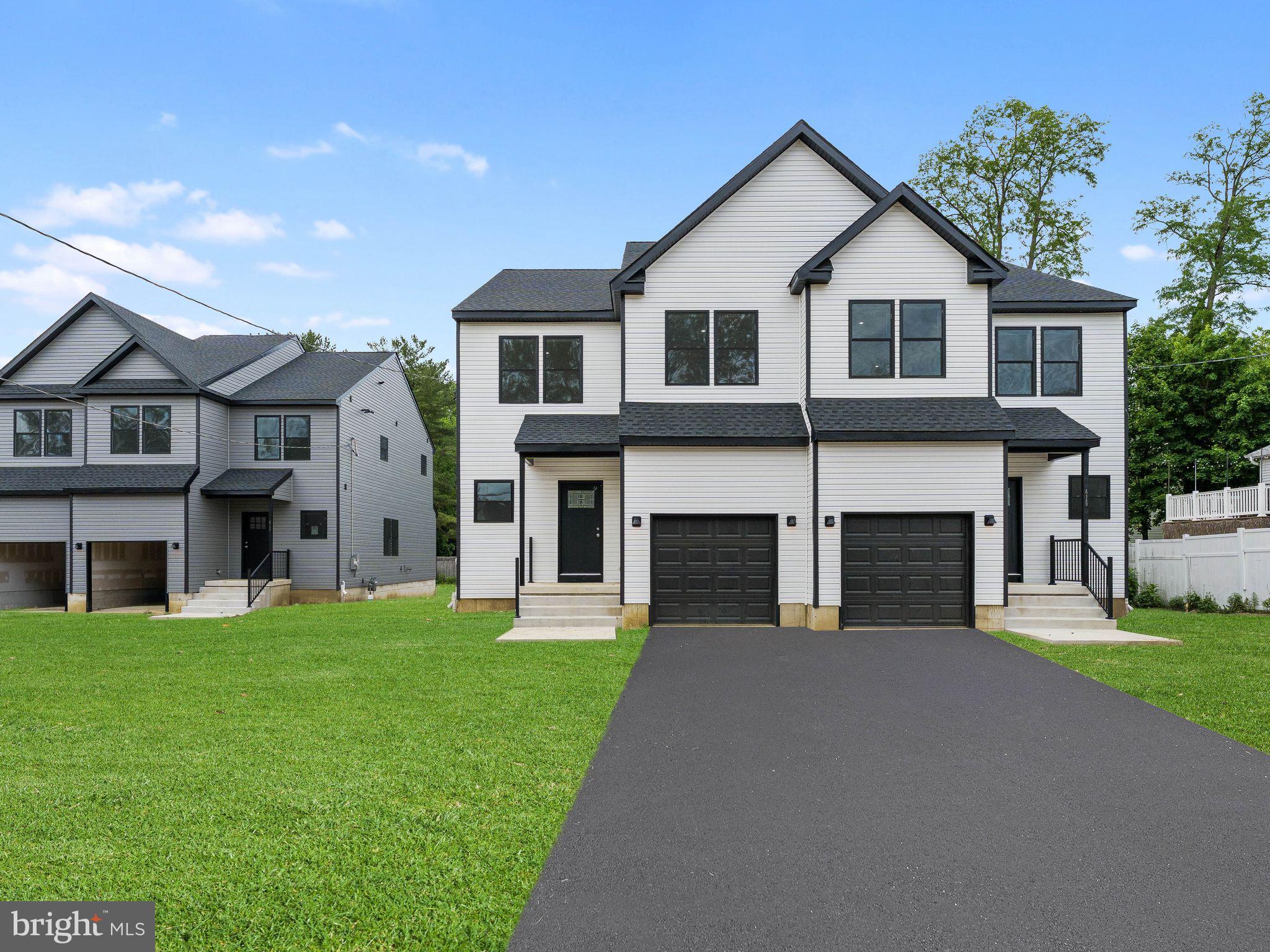 425 Almonesson Road Blackwood, NJ 08012 - Photo 4 of 51 Modern duplex with lush green lawn.