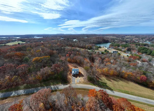 a view of a wooden house with a yard