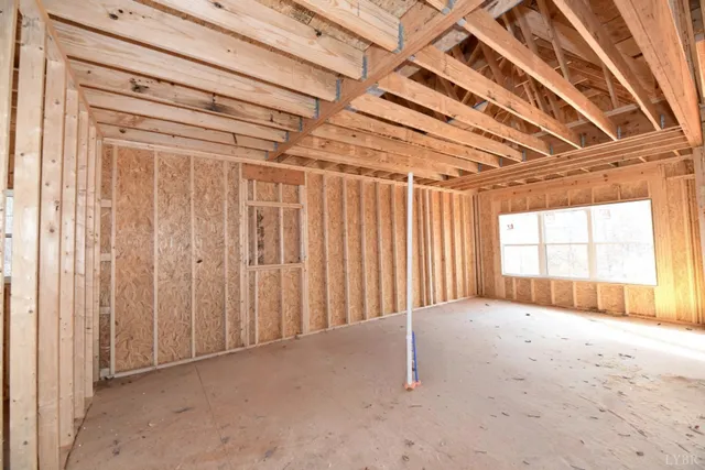 a view of an empty room with a fireplace