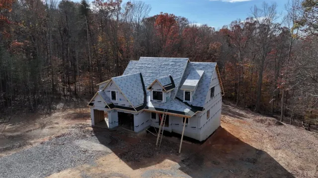 a view of a backyard with wooden fence