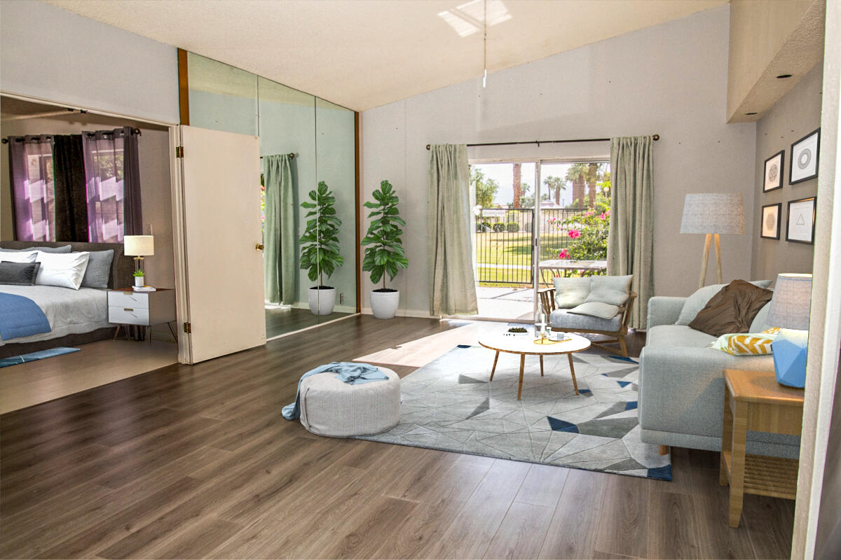 a living room with furniture and a large window