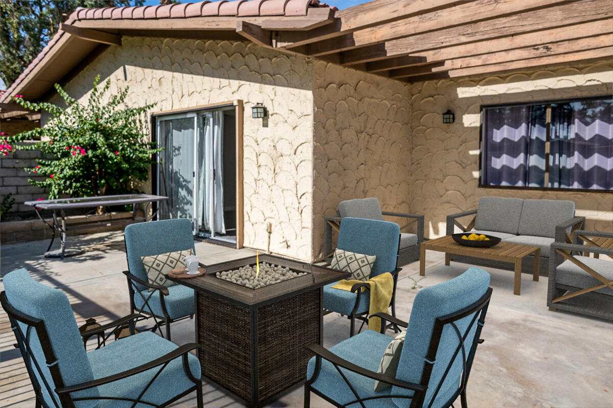 48941 Eisenhower Drive Indio, CA 92201 - Photo 14 of 17 a patio with a table and chairs