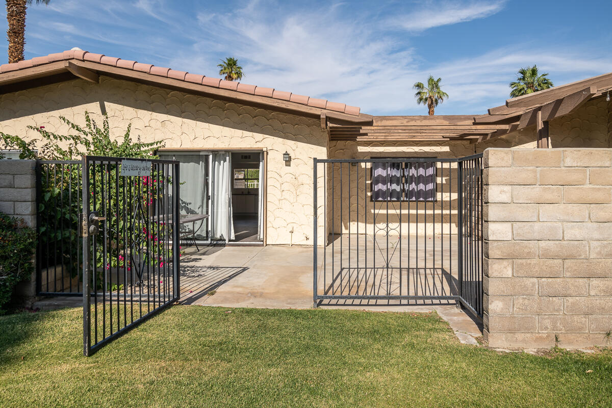 48941 Eisenhower Drive Indio, CA 92201 - Photo 16 of 17 a view of a entrance gate of the house
