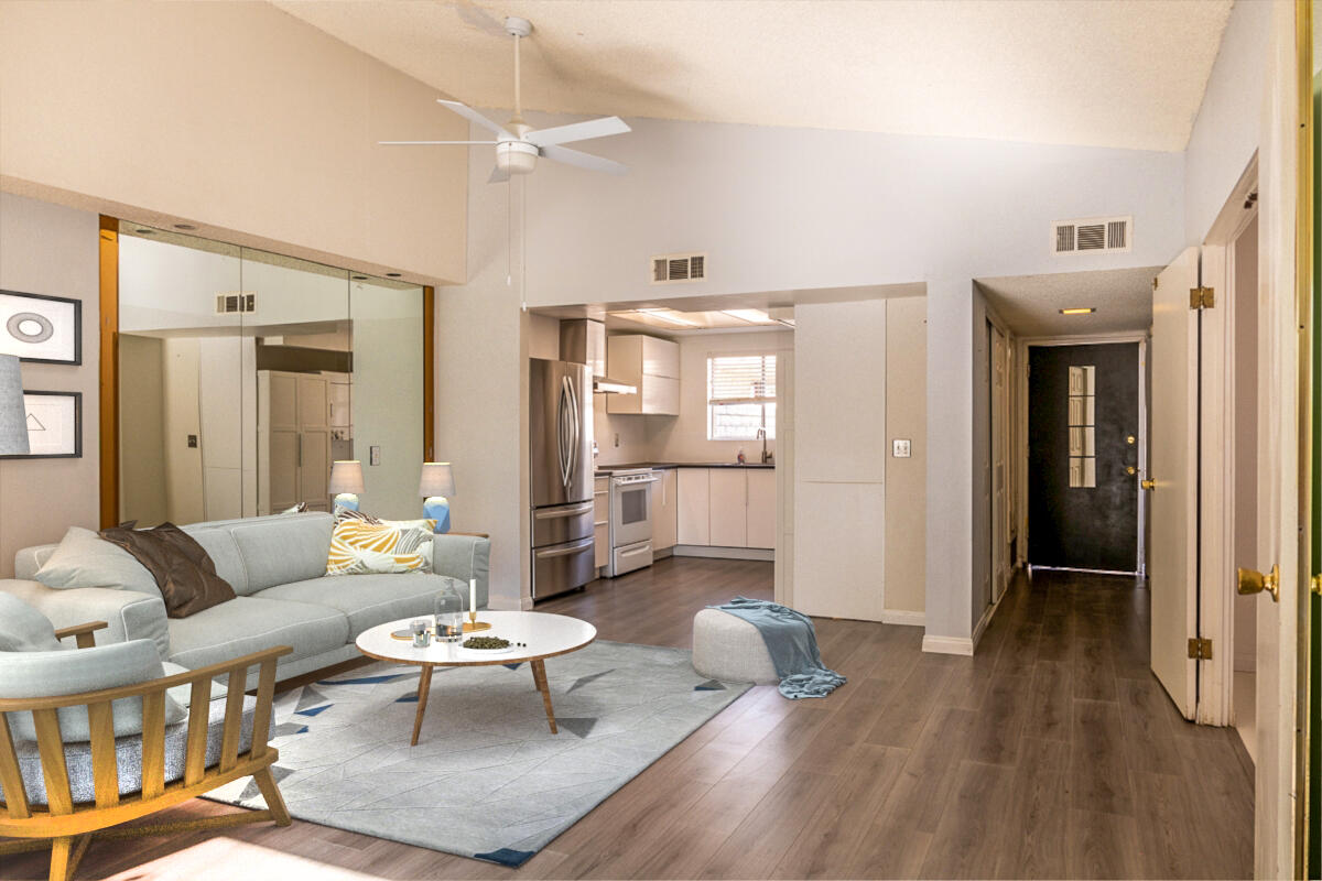 48941 Eisenhower Drive Indio, CA 92201 - Photo 2 of 17 a living room with furniture and a wooden floor