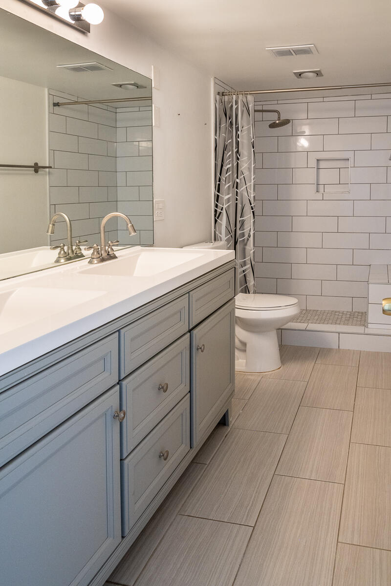 48941 Eisenhower Drive Indio, CA 92201 - Photo 7 of 17 a bathroom with a sink a toilet and shower