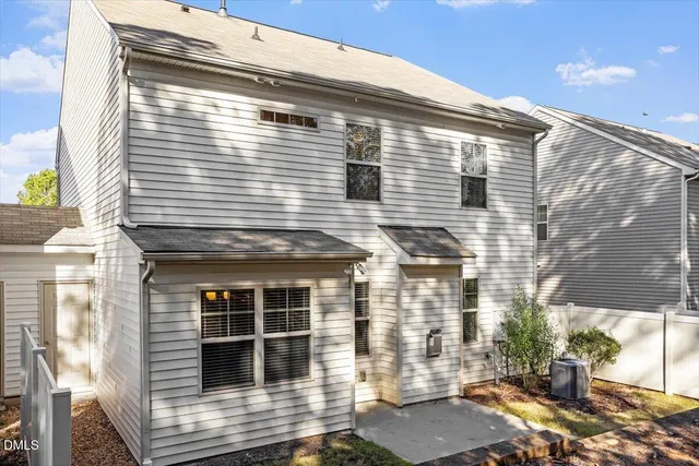 a view of a patio with plants and potted plants