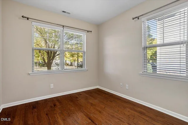 wooden floor with white walls