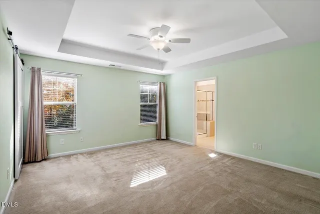 a kitchen with granite countertop a refrigerator stove and microwave