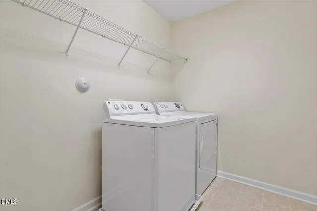 a bathroom with a granite countertop sink a mirror and shower