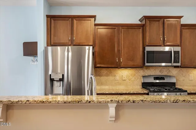 a view of a kitchen with a stove cabinets and wooden floor