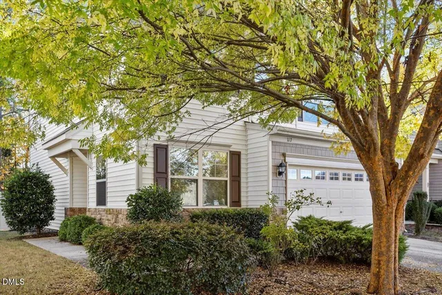 a view of a house with a tree