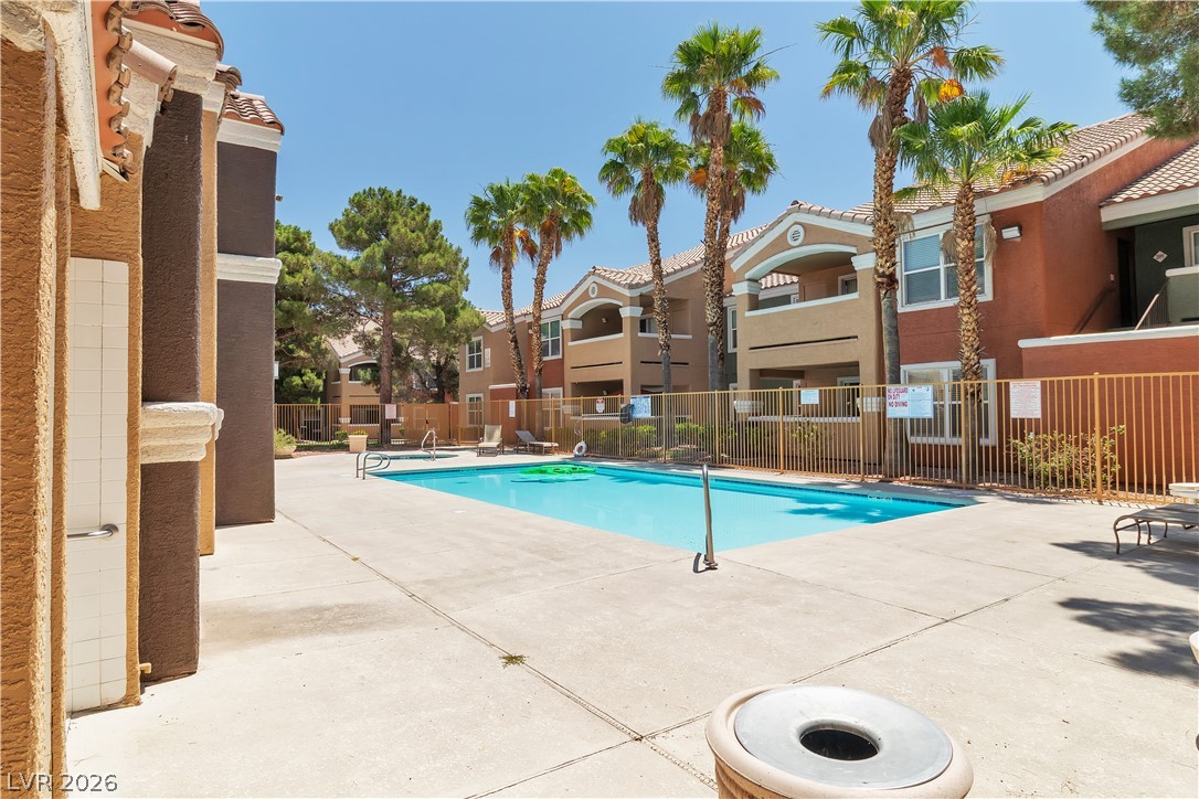 8101 West Flamingo Road, Unit 2001 Las Vegas, NV 89147 - Photo 27 of 28 A refreshing pool awaits in this vibrant community, perfect for sun-drenched leisure and social gatherings.