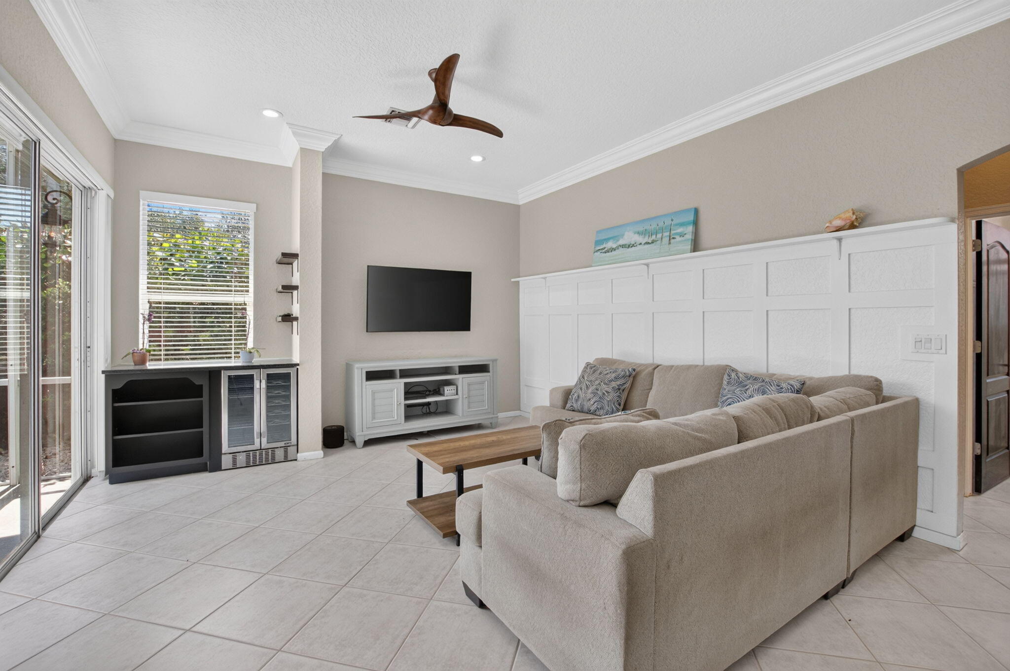 1365 East Barwick Ranch Circle Delray Beach, FL 33445 - Photo 41 of 77 a living room with furniture and a flat screen tv